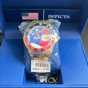 Invicta Gold Watch with Red, Blue, and Yellow Bezel
